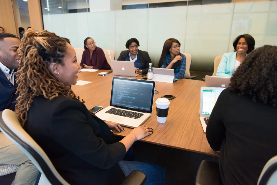 A team planning together around a meeting table