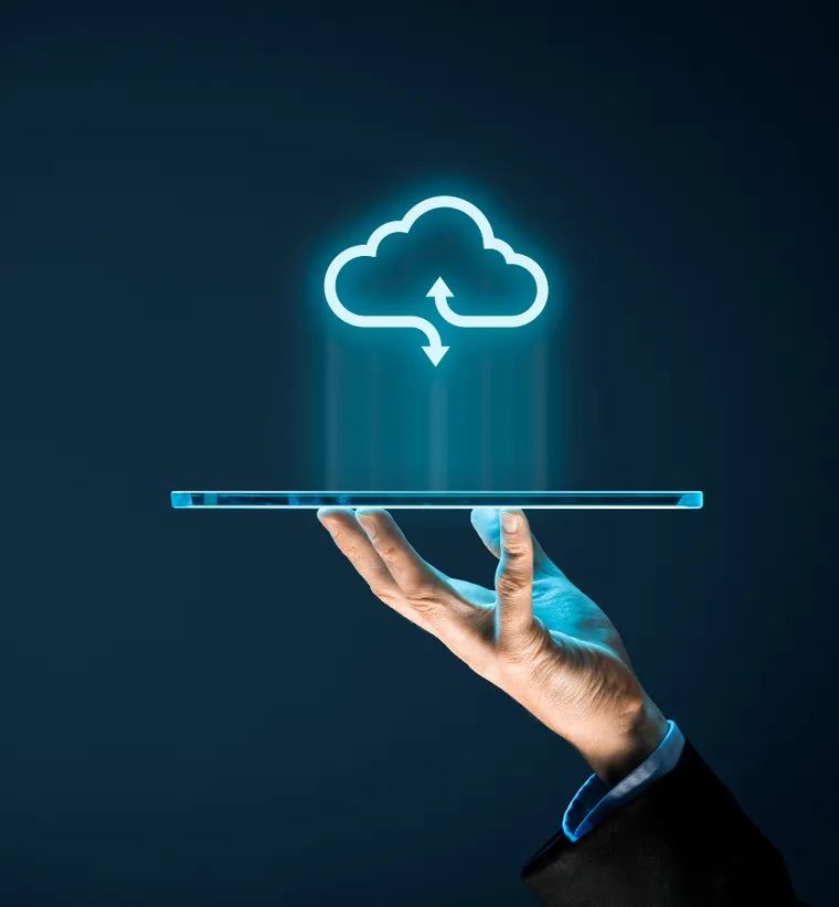 Hand holding a tablet with a glowing cloud sync icon above it
