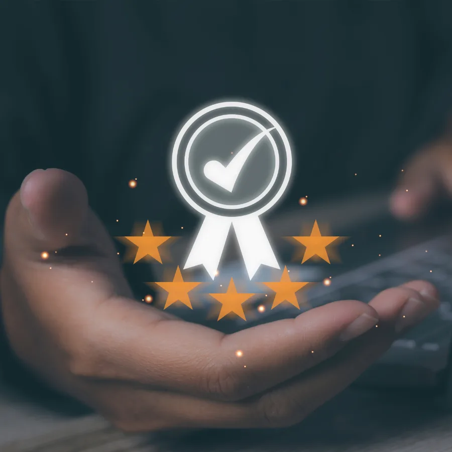 Certification badge and stars held in an open hand
