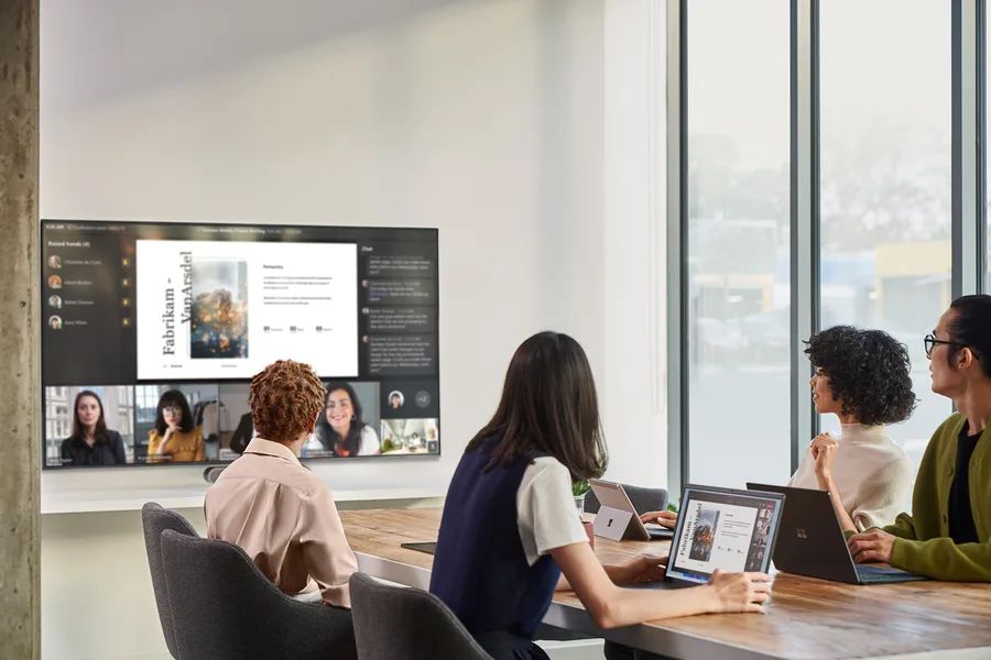 Meeting room joining a Teams call on a wall screen