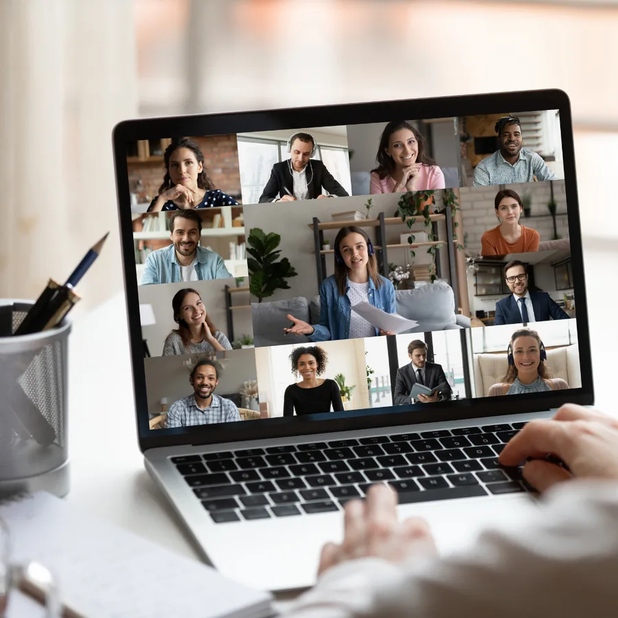 Laptop showing a grid of colleagues on a video call