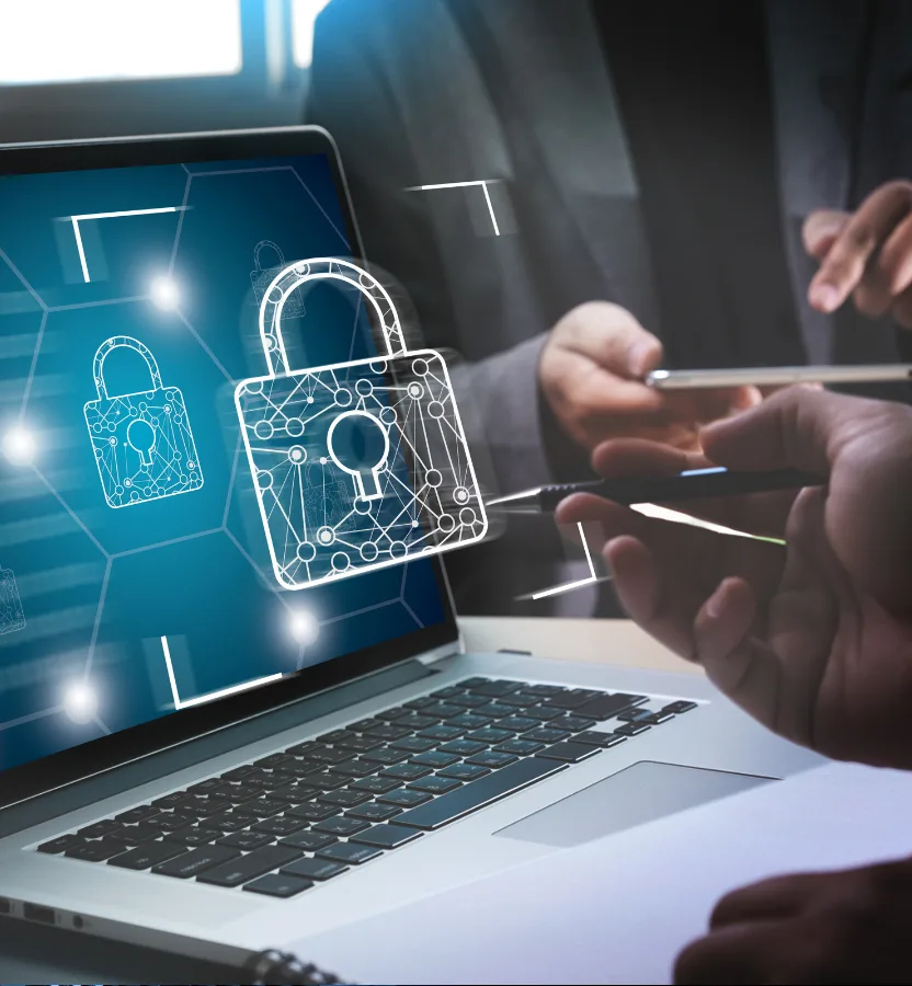 Padlock graphics over a laptop as two people talk through security