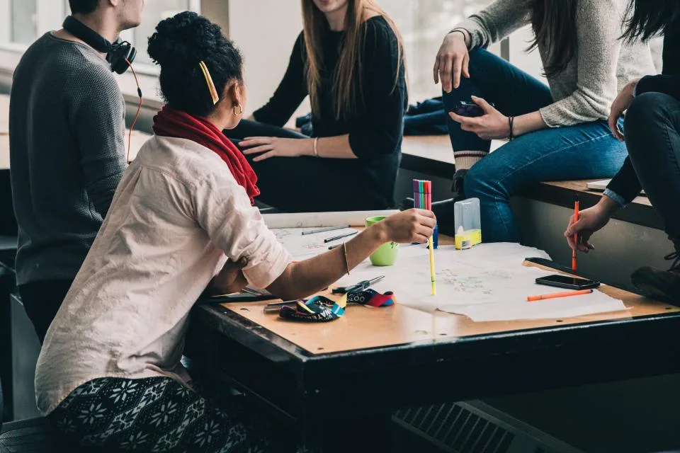 Students working together around a shared table