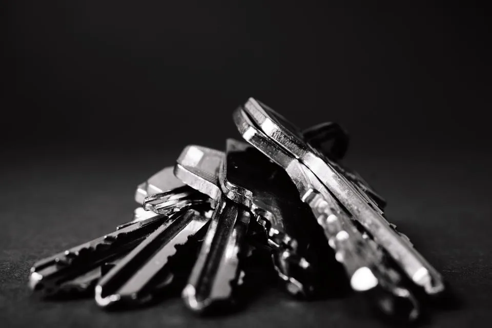 A set of keys on a dark surface