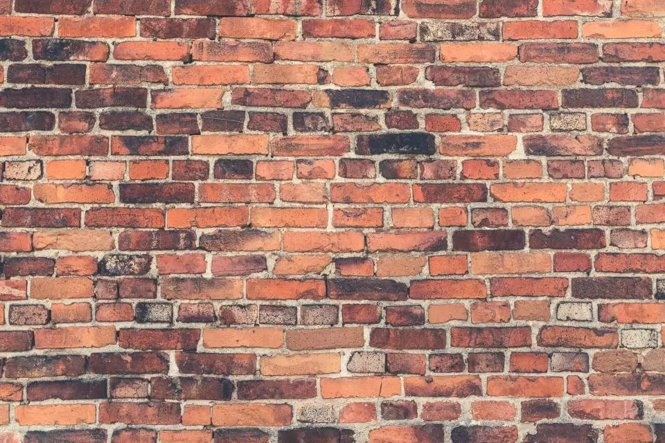 Weathered red brick wall