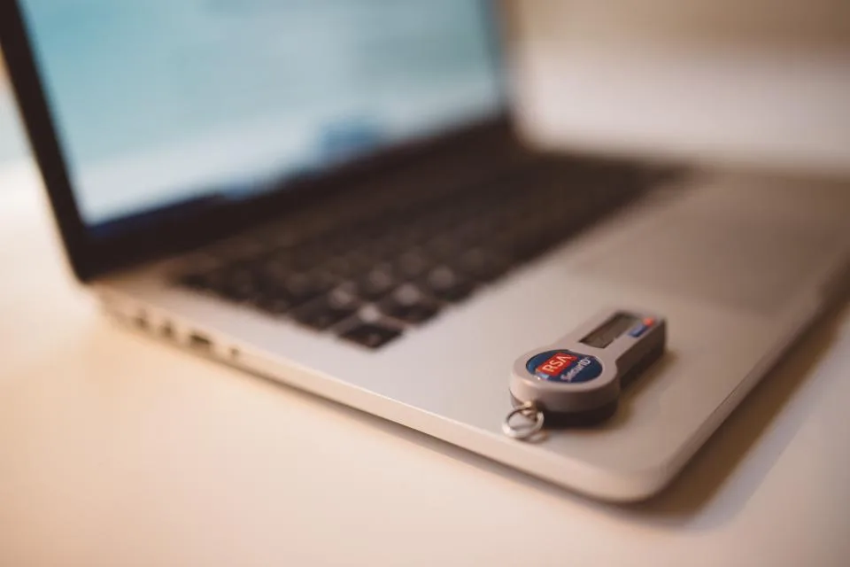 Multi-factor authentication token resting on a laptop