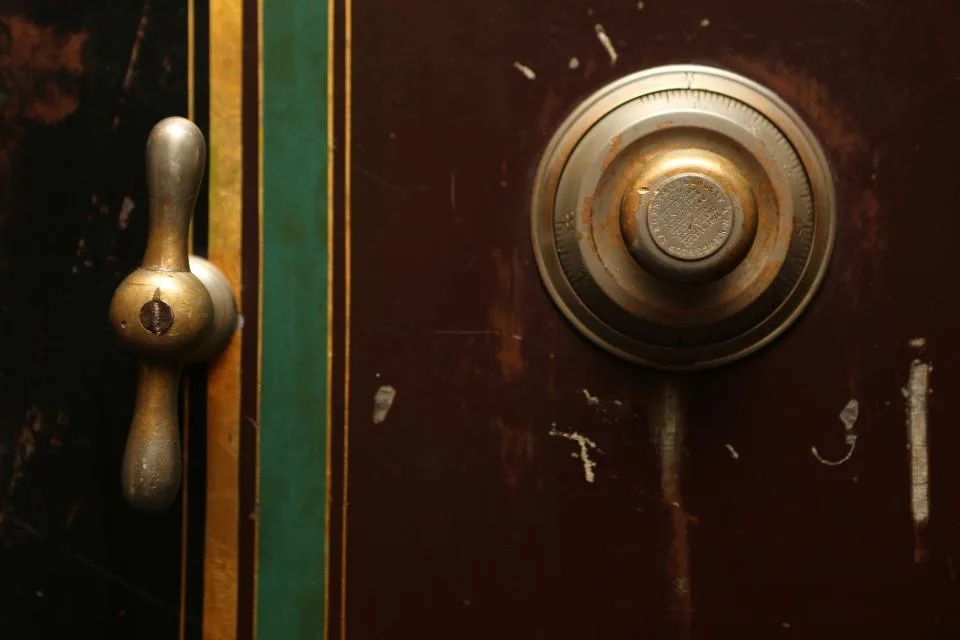 Combination dial and handle on a heavy safe door