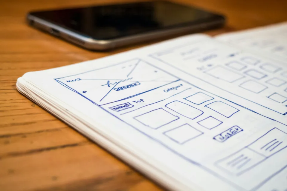 Website layout sketched as a wireframe in a notebook